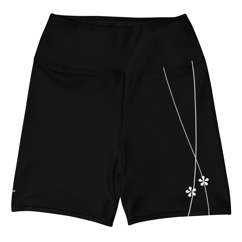 DuelStars black yoga shorts with white floral print, flat lay front view
