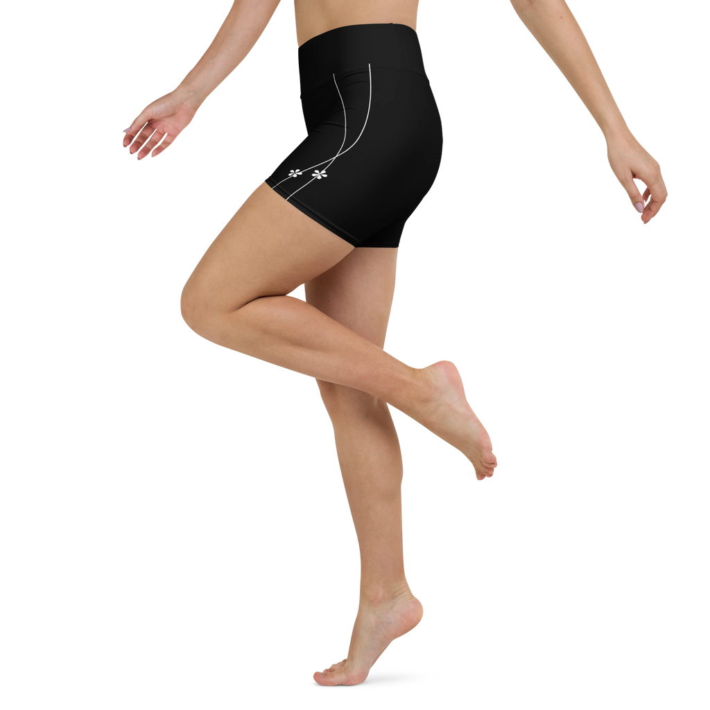 DuelStars black yoga shorts with white floral print, side leg view
