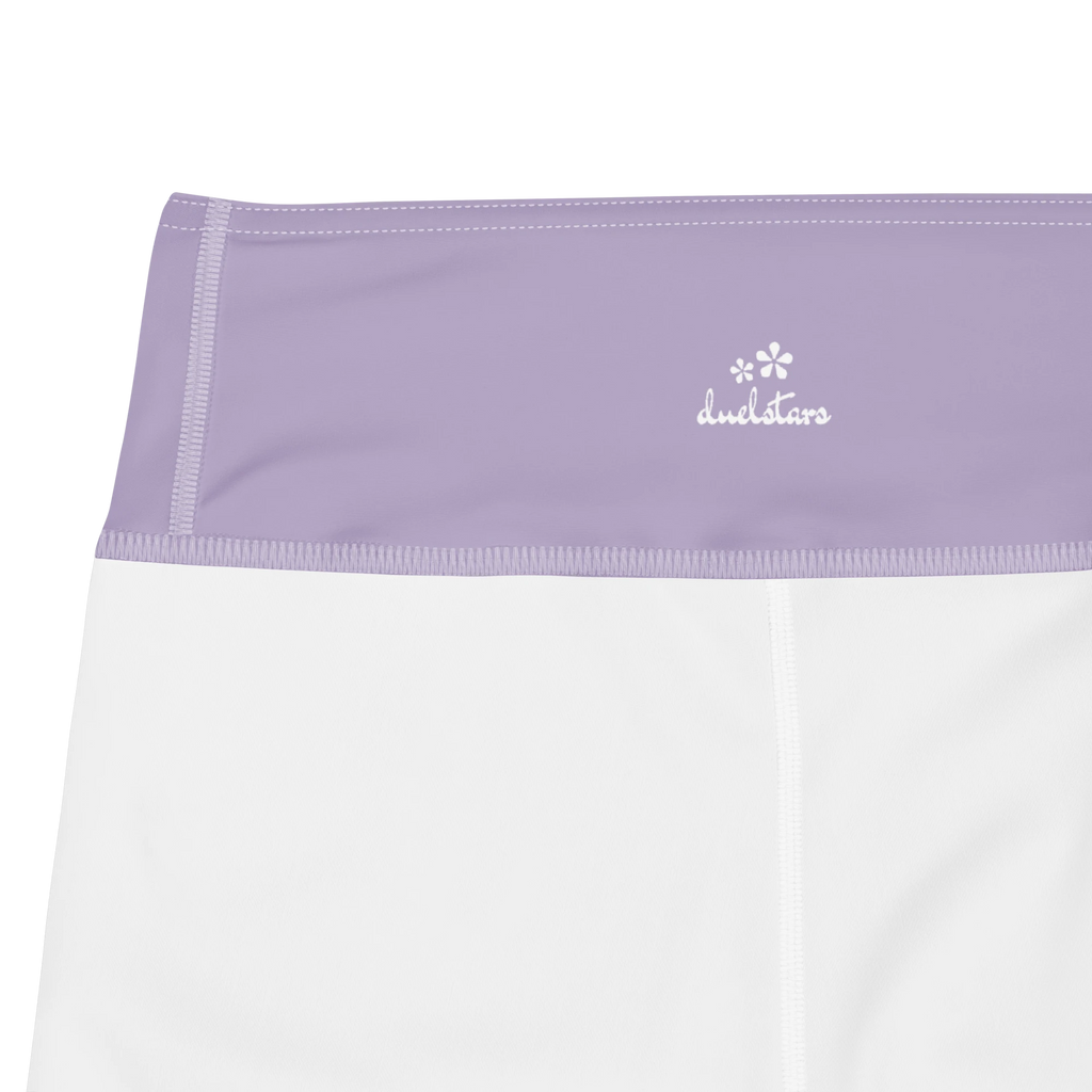 Close-up of the DuelStars label on misty lavender yoga shorts with ivory white floral print 