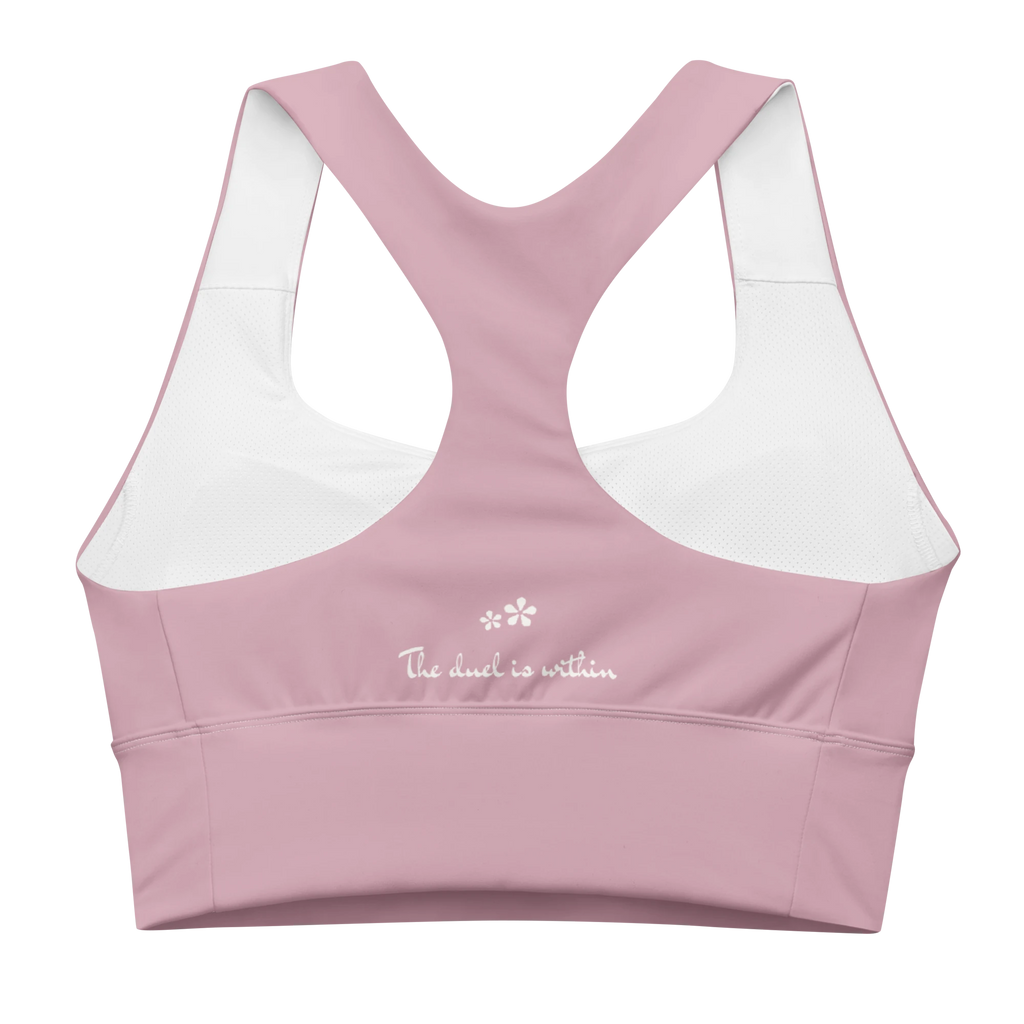 Back view flat lay of the DuelStars Core Femme sports bra in dusty rose, featuring the inspirational slogan 'the duel is within' printed across the back.