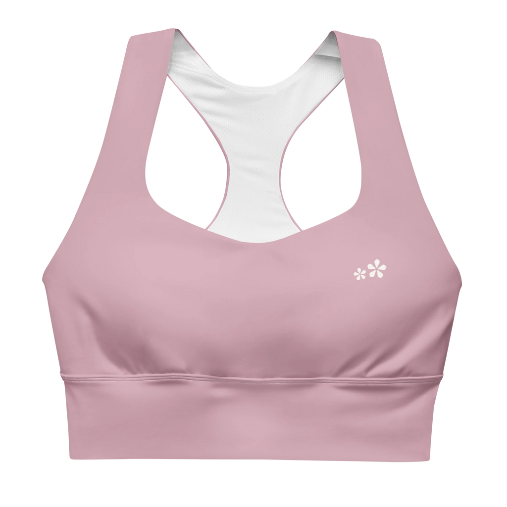 Front view flat lay of the DuelStars Core Femme sports bra in dusty rose, featuring the delicate Blossom logo on the chest.