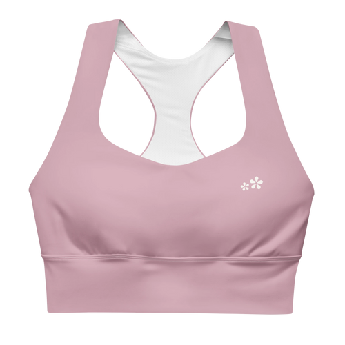 Front view flat lay of the DuelStars Core Femme sports bra in dusty rose, featuring the delicate Blossom logo on the chest.