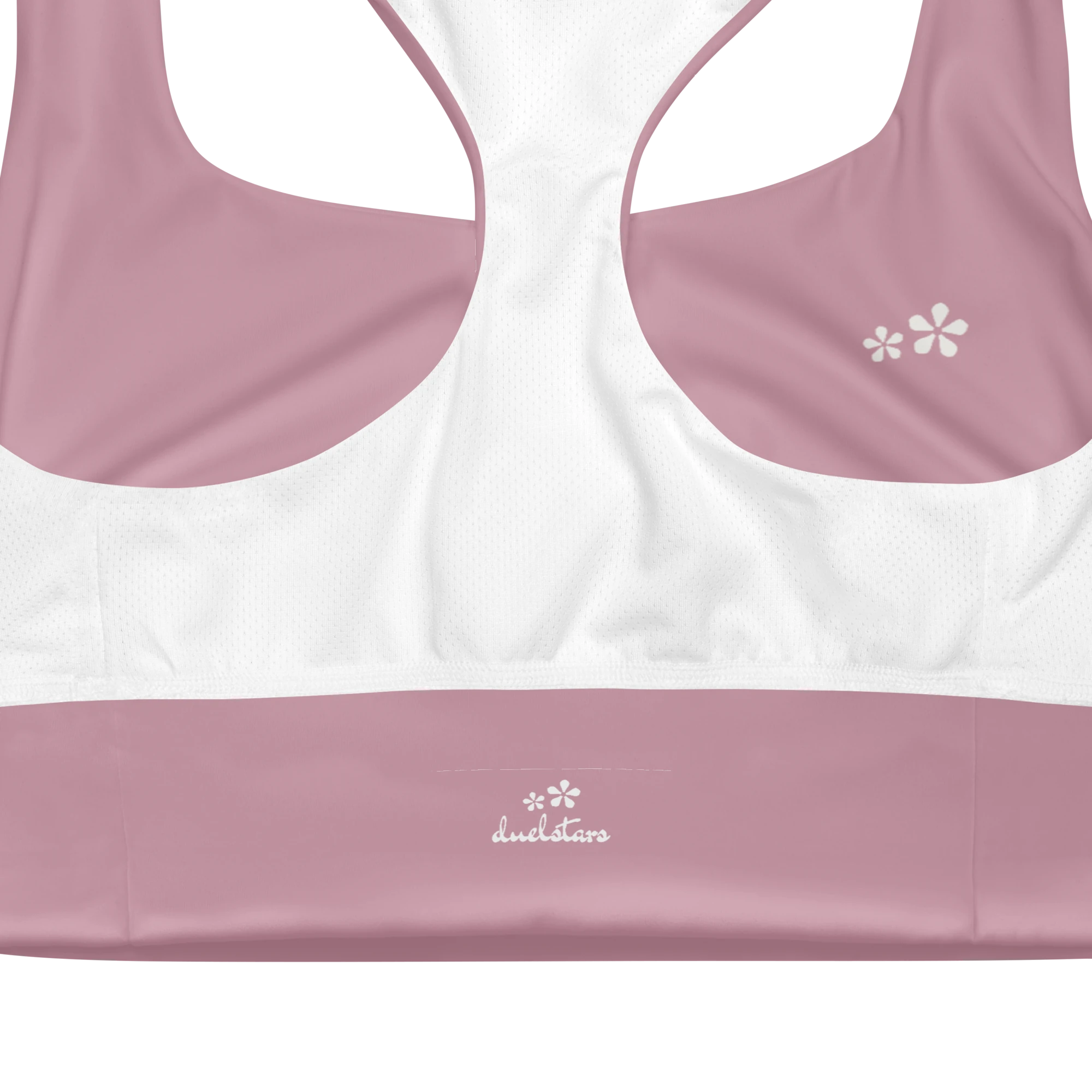 Close-up view of the inside label on the DuelStars Core Femme sports bra in dusty rose, showing the branded DuelStars logo 