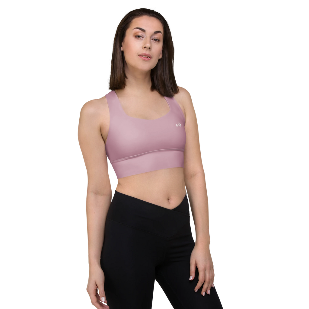 Front right-side view of the DuelStars Core Femme yoga sports bra in dusty rose, showcasing the delicate floral print and the fit of the straps.