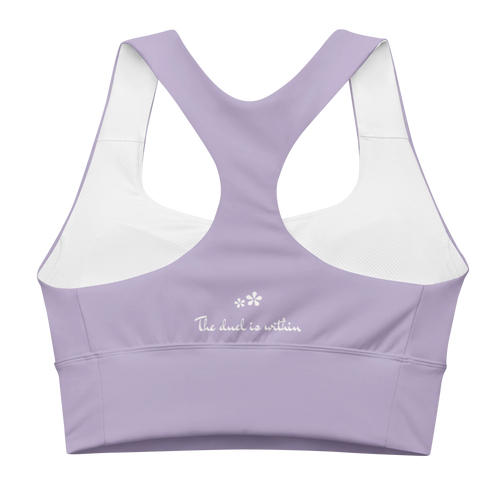 Back view flat lay of the DuelStars Core Femme sports bra in misty lavender, featuring the inspirational slogan 'the duel is within' printed across the back.