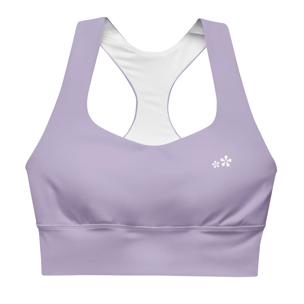 Front view flat lay of the DuelStars Core Femme sports bra in misty lavender, featuring the delicate Blossom logo on the chest.