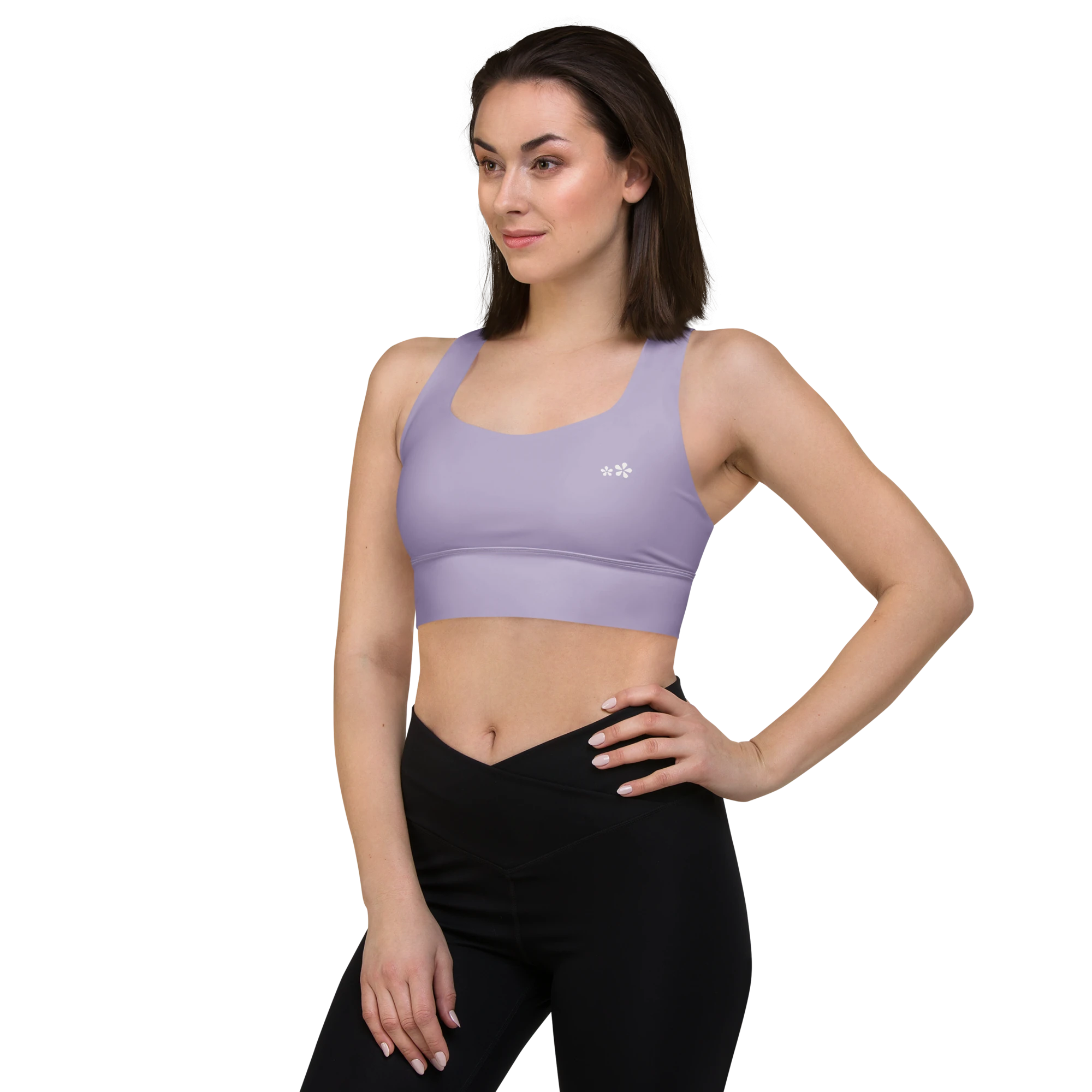 Front left-side view of the DuelStars Core Femme yoga sports bra in misty lavender, showcasing the delicate floral print and the fit of the straps.