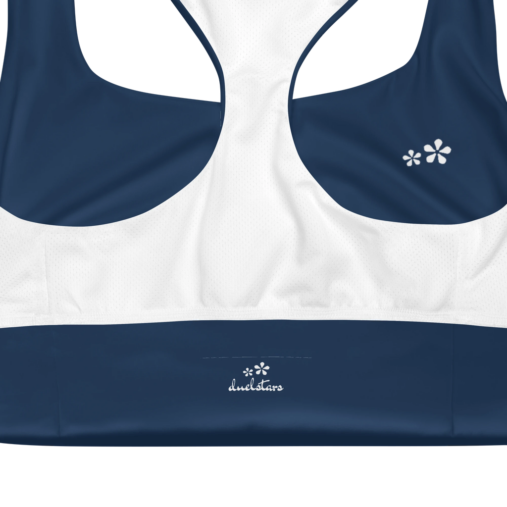 Close-up view of the inside label on the DuelStars Core Femme sports bra in ocean blue, showing the branded DuelStars logo 