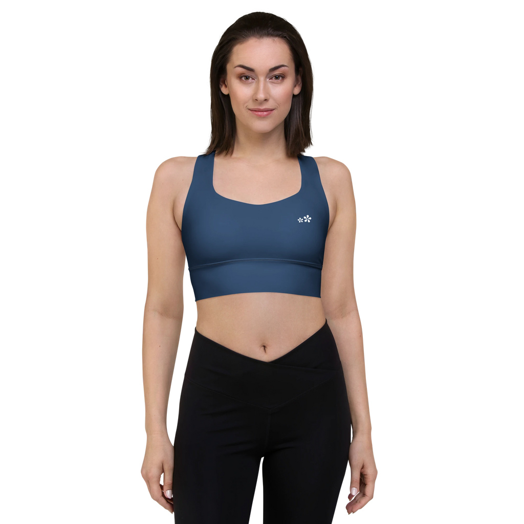 Front front view of the DuelStars Core Femme yoga sports bra in ocean blue, showcasing the delicate floral print and the fit of the straps.