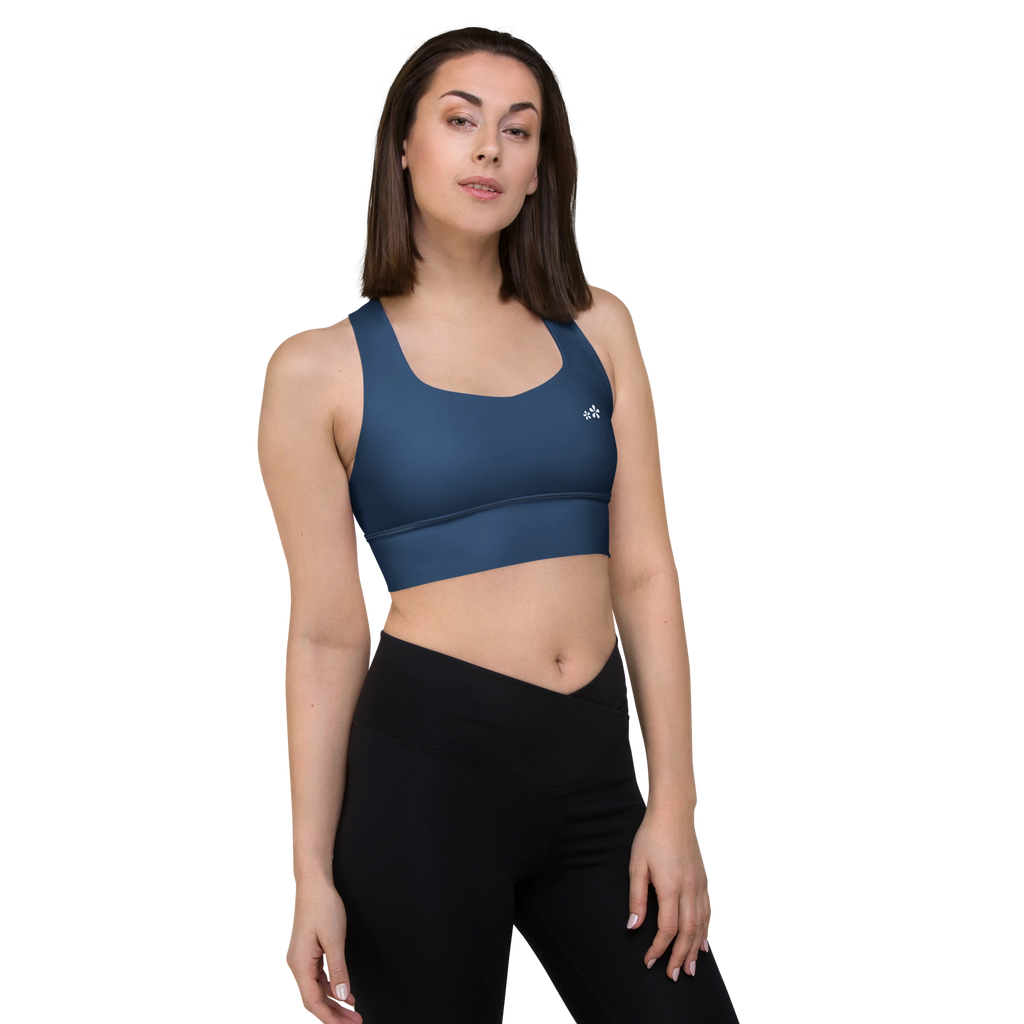 Front right-side view of the DuelStars Core Femme yoga sports bra in ocean blue, showcasing the delicate floral print and the fit of the straps.