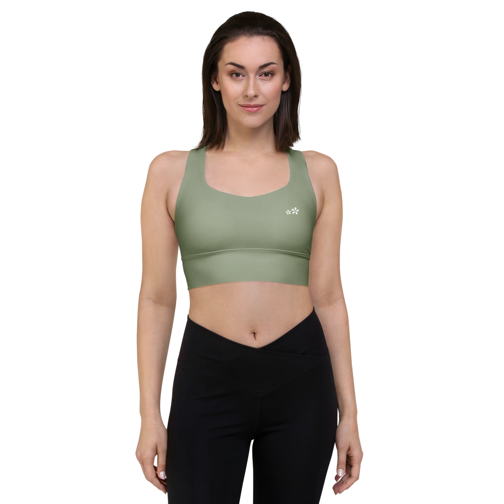 Front front view of the DuelStars Core Femme yoga sports bra in sage green, showcasing the delicate floral print and the fit of the straps.
