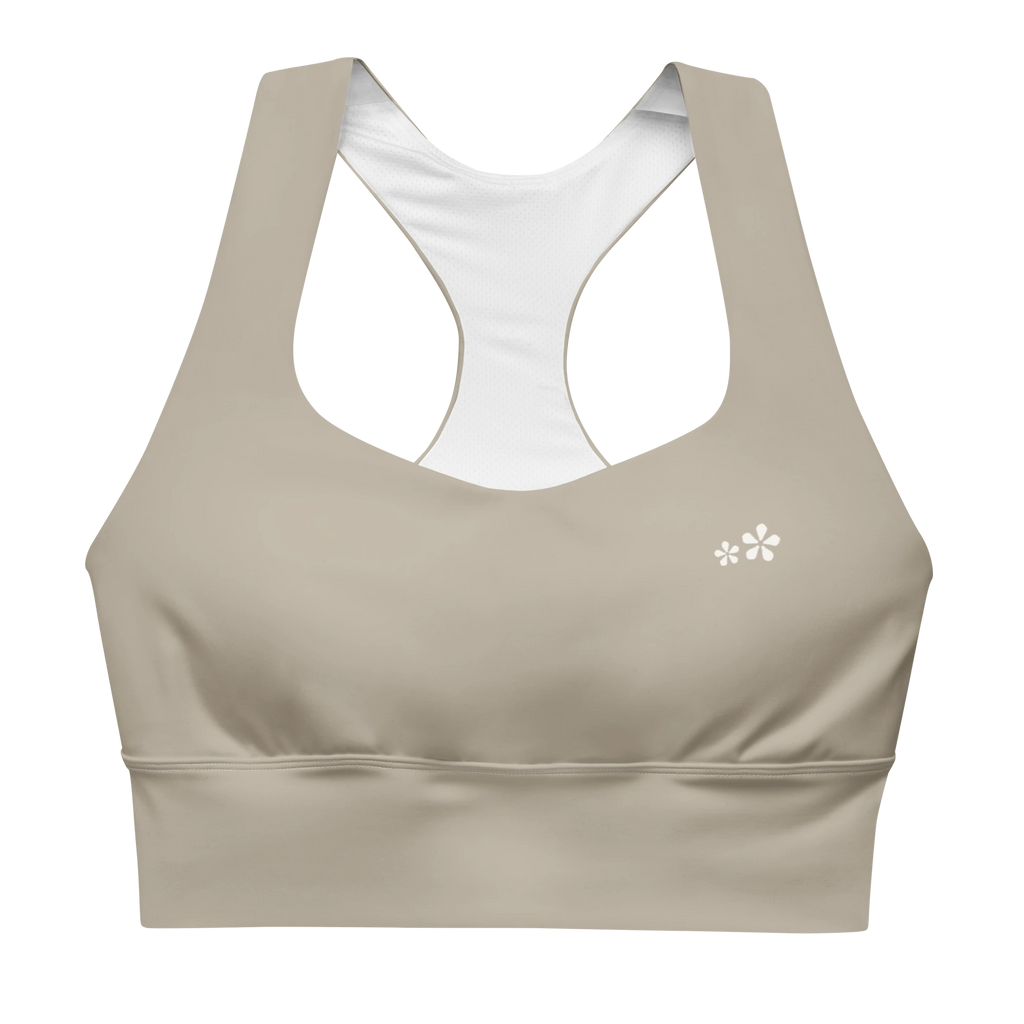 Front view flat lay of the DuelStars Core Femme sports bra in stone grey, featuring the delicate Blossom logo on the chest.
